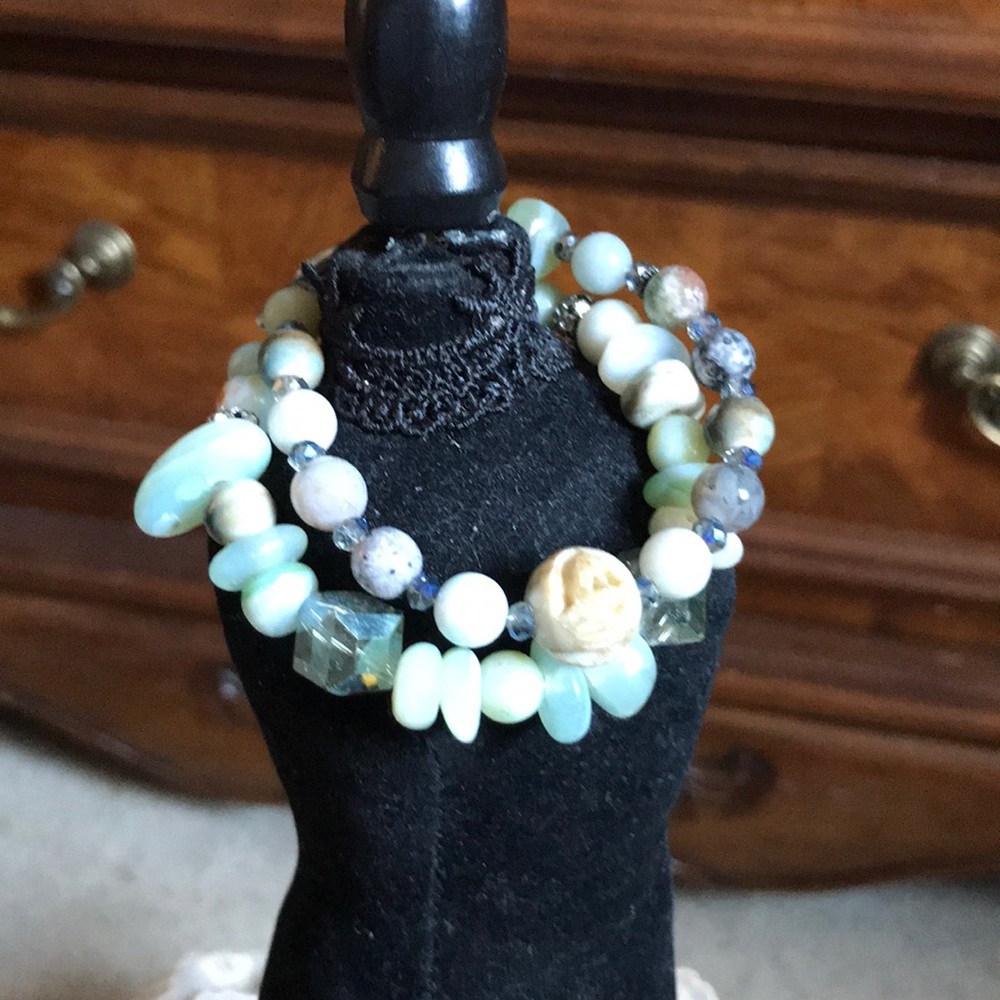 Two  green glass bead bracelets.
